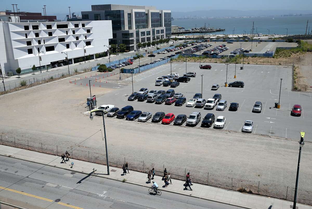 Cars are parked on the Mission Bay site in San Francisco, Calif. on Thursday, June 18, 2015 where the Warriors hope to build a new basketball arena.