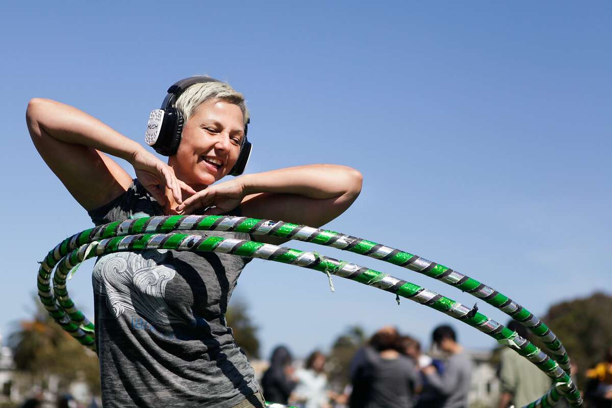 Dolores Park reopened Thursday and held a park-sponsored silent disco. Kim Eitze can be seen hula hooping while listening to some music.