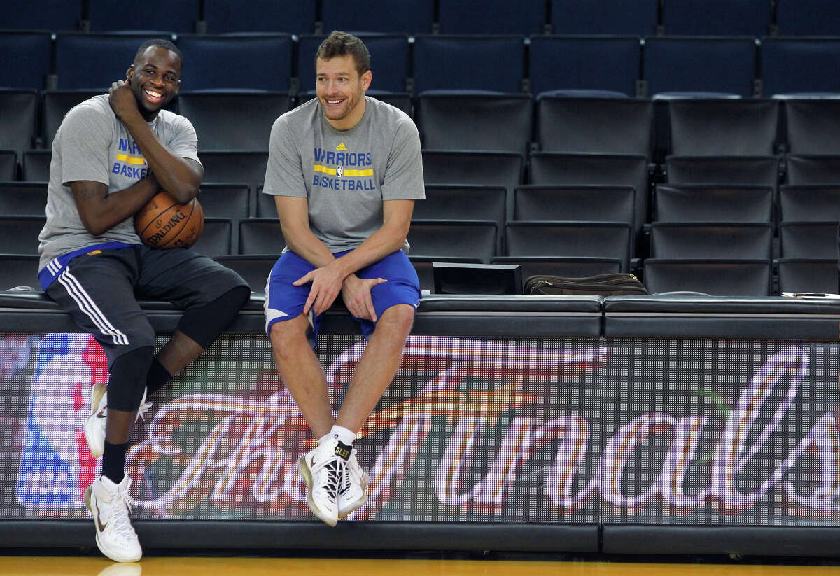 Draymond Green (left) took David Lee’s starting position at the start of the season and then, in Game 3 of the NBA Finals, received a lesson from Lee about attacking on offense. They sat together as champions on the flight home after Game 6.