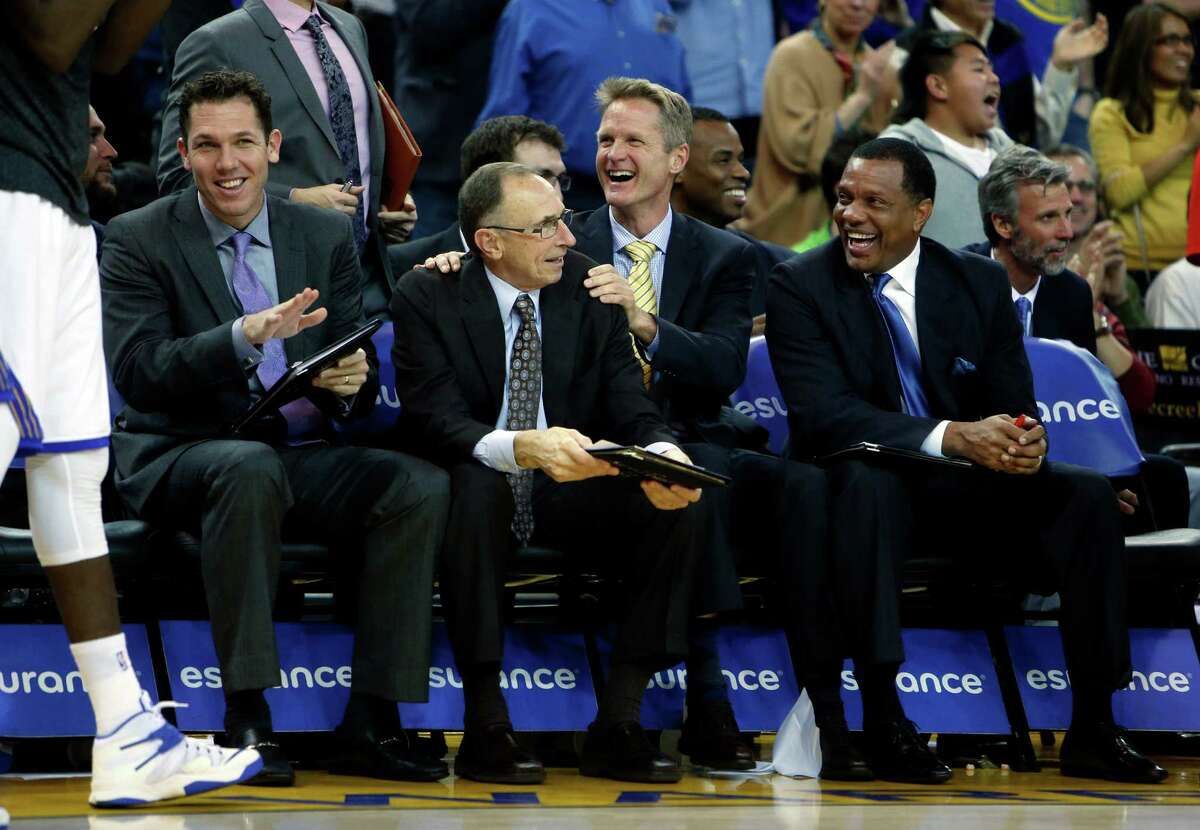 (left to right) Golden State Warriors' coaches Luke Walton, Ron Adams, Steve Kerr and Alvin Gentry enjoy a block by rookie James Michael McAdoo in 4th quarter of Warriors' 122-79 win over the Denver Nuggets during NBA game at Oracle Arena in Oakland, Calif. on Monday, January 19, 2015.