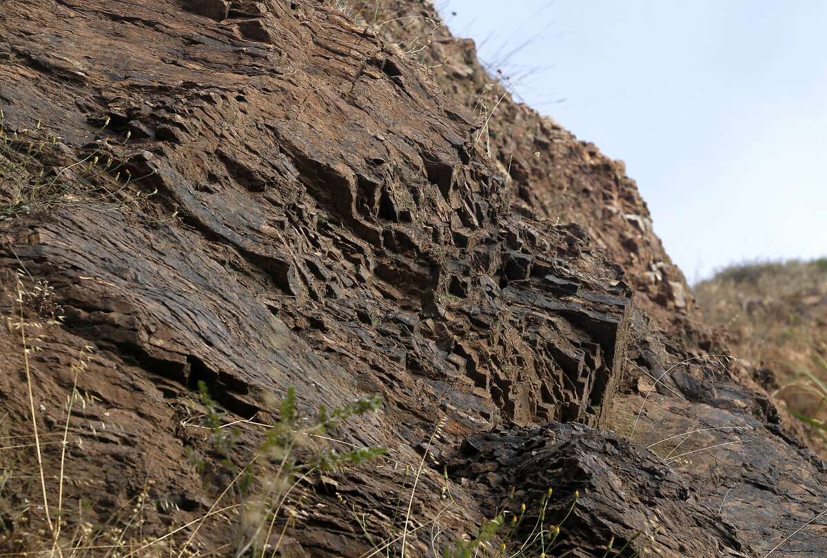 Rock formations known as radiolarian chert is seen above a section of O'Shaugnessy Boulevard in San Francisco, Calif. on Friday, June 19, 2015.