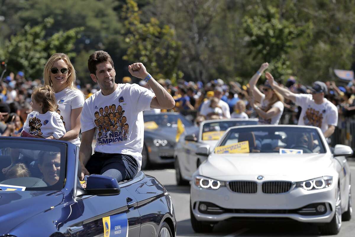 Warriors General Manager Bob Myers rides in the Warriors parade on Lakeside Drive on Friday. The Golden State Warriors celebrated their first NBA Championship in 40 years with a parade through Oakland, Calif., on Friday, June 19, 2015.