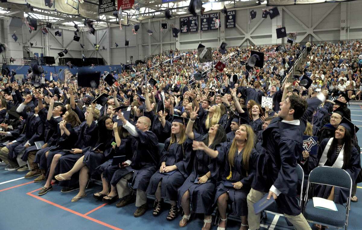 Graduates fling their caps into the air at the end of the 2015 New Fairfield High School Commencement Exercises, on Saturday morning, June 20, 2015, held at the O'Neil Center at Western Connecticut State University, in Danbury, Conn.