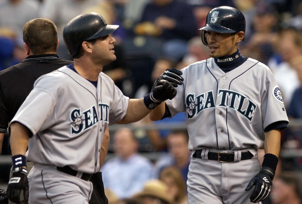 Former Seattle Mariners designated hitter Edgar Martinez, right, is greeted  by former teammate Ken Griffey Jr. while Martinez was being honored for his  recent induction into the Baseball Hall of Fame, before