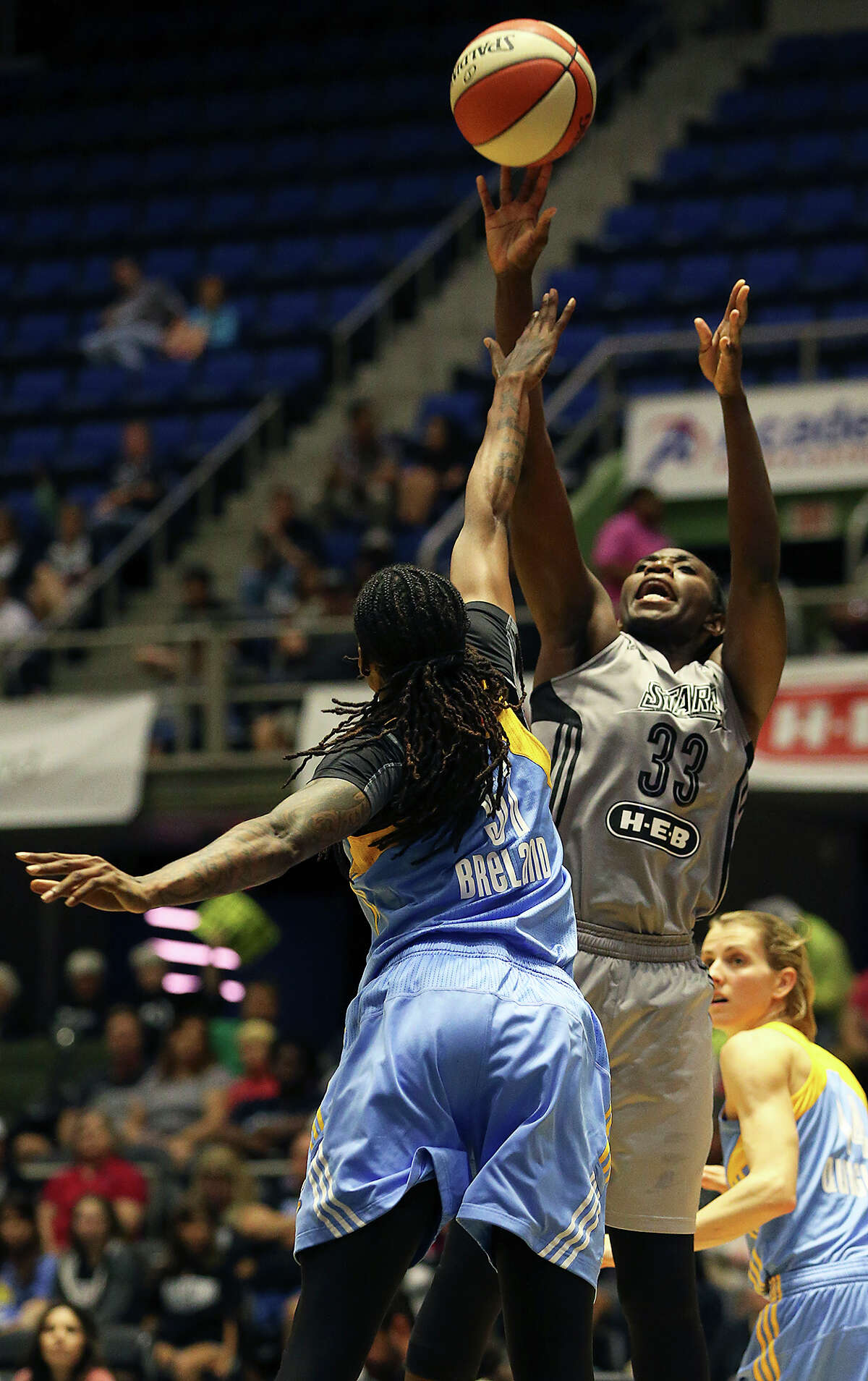Sophia Young-Malcolm gets off a jumper against Jessica Breland as the San Antonio Stars host the Chicago Sky at Freeman Coliseum on June 20, 2015.