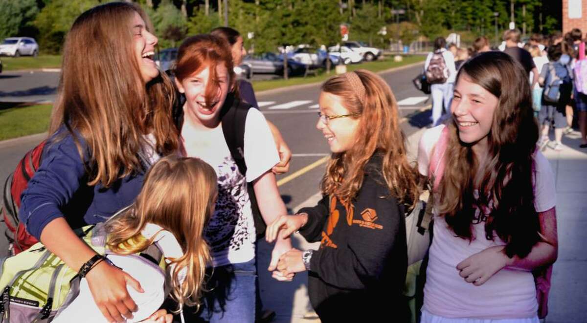Lilly Returning seventh graders greet each other after getting off different busses outside Scotts Ridge Middle School in Ridgefield on the first day of classes, Sept. 1, 2009. From top left are: Emma Butturini, Lilly Whitmore, Eliza Wendel and Jacklyn Danbrousio.