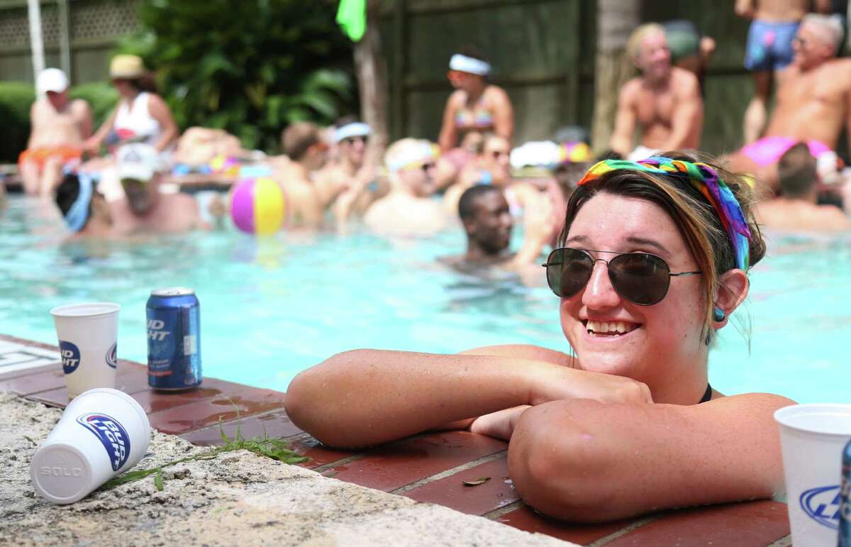Breanna Sinclair takes a break from swimming at Salvation: A Pride Pool Party at HI Houston Sunday, June 21, 2015, in Houston.