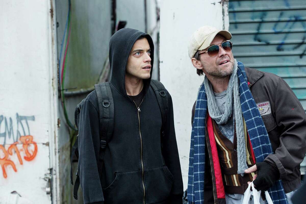 Rami Malek, left, as Elliot and Christian Slater as Mr. Robot in USA Network's 'Mr. Robot,' a thriller about high-tech hackers.