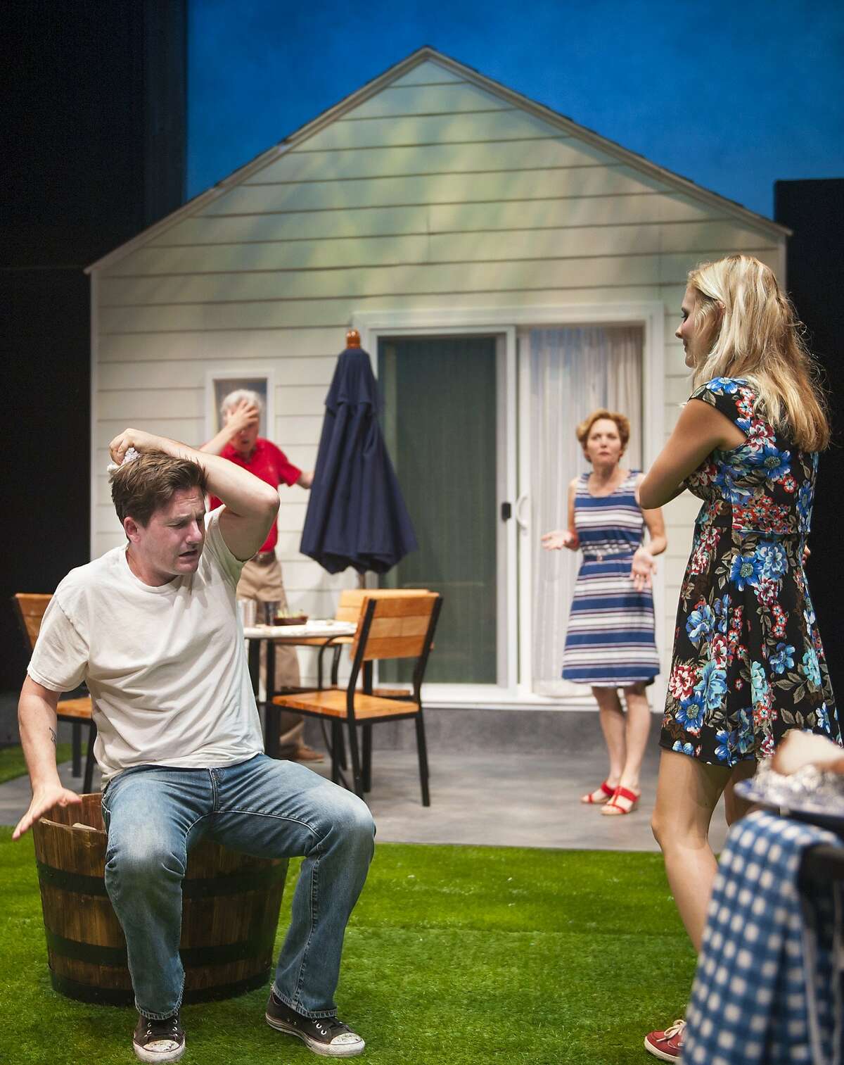 Ben (Jeff Garrett, left rear) and Mary's (Amy Resnick, right rear) backyard barbecue for new neighbor Kenny (Patrick Kelly Jones, left) and Sharon (Luisa Frasconi) gets a little out of control in "Detroit" at Aurora Theatre