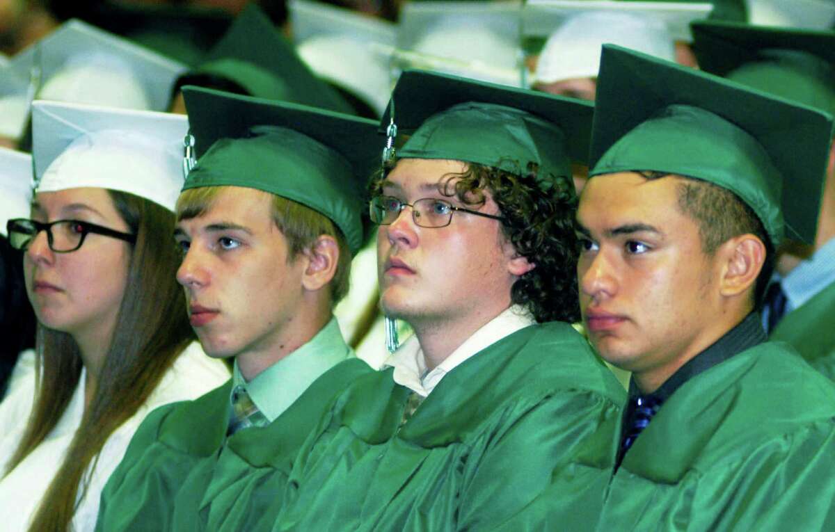 Engaged in the words of a fellow grad are, from left to right, Alissa Assad, Zachary Arnold, Michael Armstrong and Jorge Arcuri, during the New Milford High School commencement ceremony at the O'Neill Center, on the campus of Western Connecticut State University in Danbury, June 20, 2015.