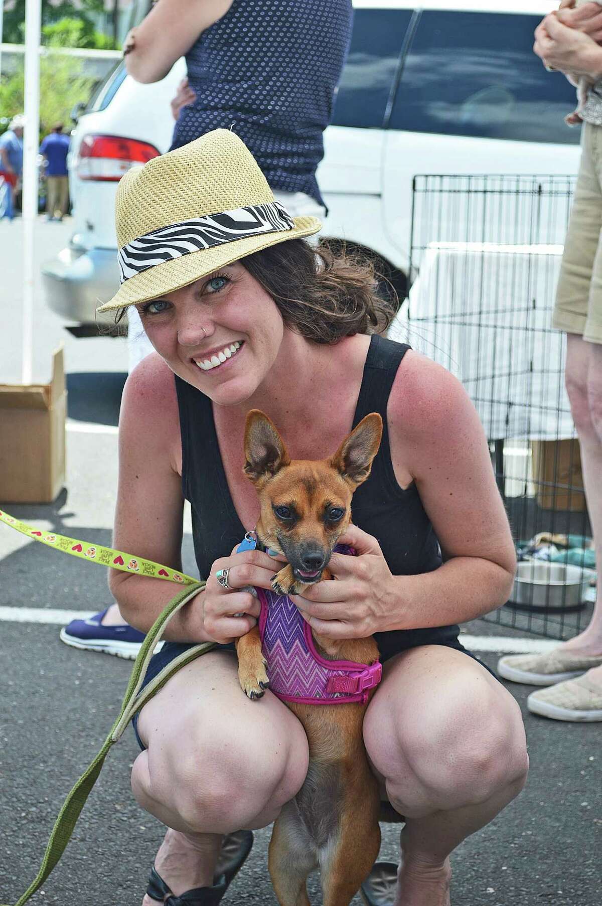 Nichole Wells of Stratford and her friend Shirley, a chihuahua mix, at the at the Sixth Annual New Canaan Dog Days event Sunday.
