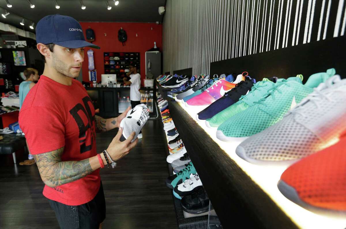 Sean Mata shops ﻿at Premium Goods,﻿ a designer fitness shoe store whose manager says it isn't hurting.