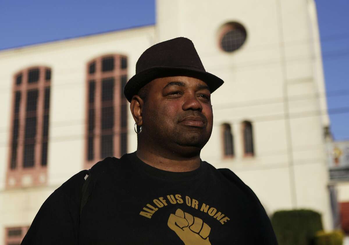 Will Walker poses in her neighborhood on June 23, 2015. Walker was subjugated to police injustice in 1998 after purchasing crack cocaine in San Francisco. During his arrest he noted that there were two white males smoking crack in front of the police officers as he was being taken away.