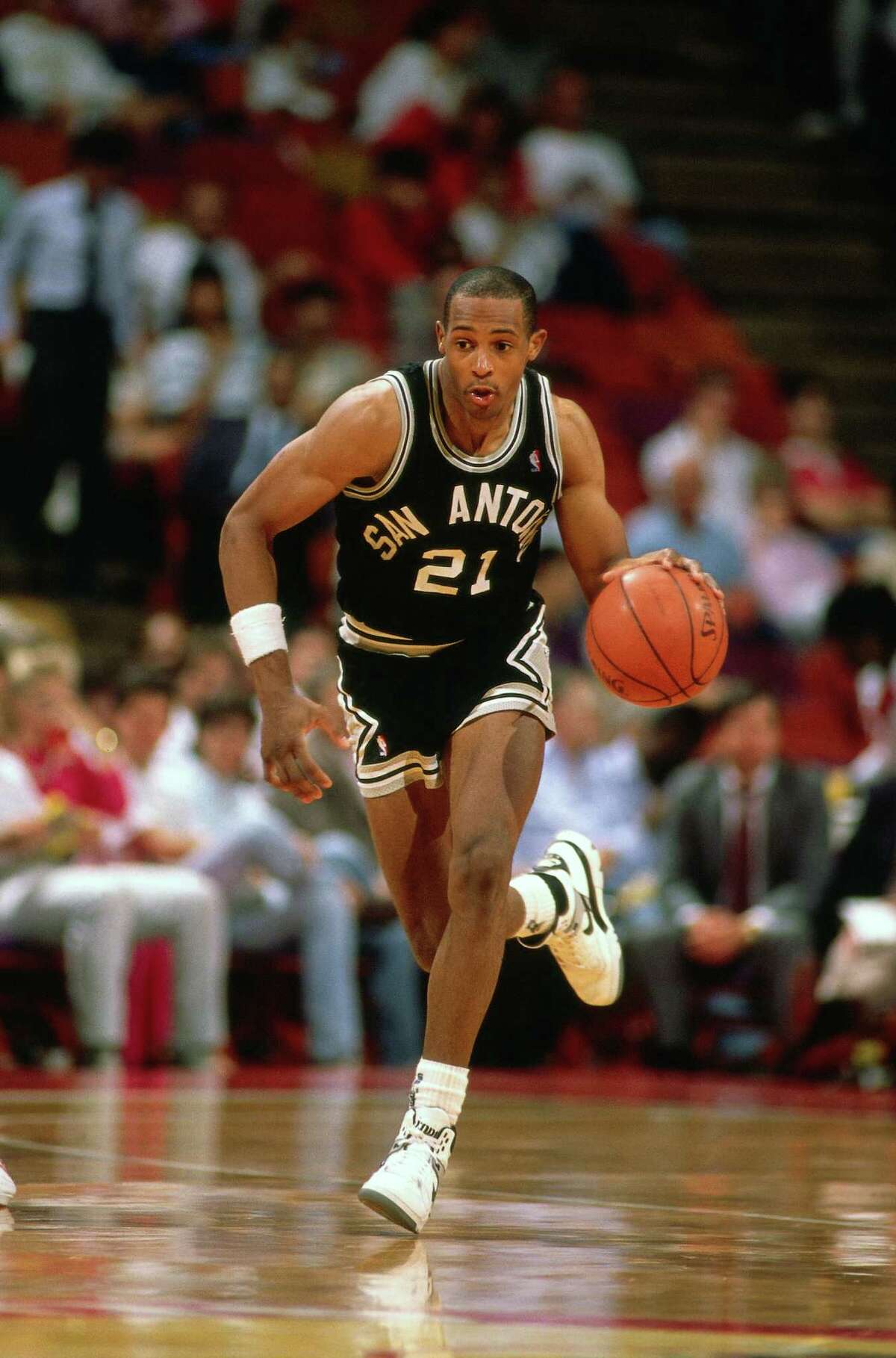 Alvin Robertson of the Spurs dribbles up court against the Rockets at The Summit in Houston in 1988.