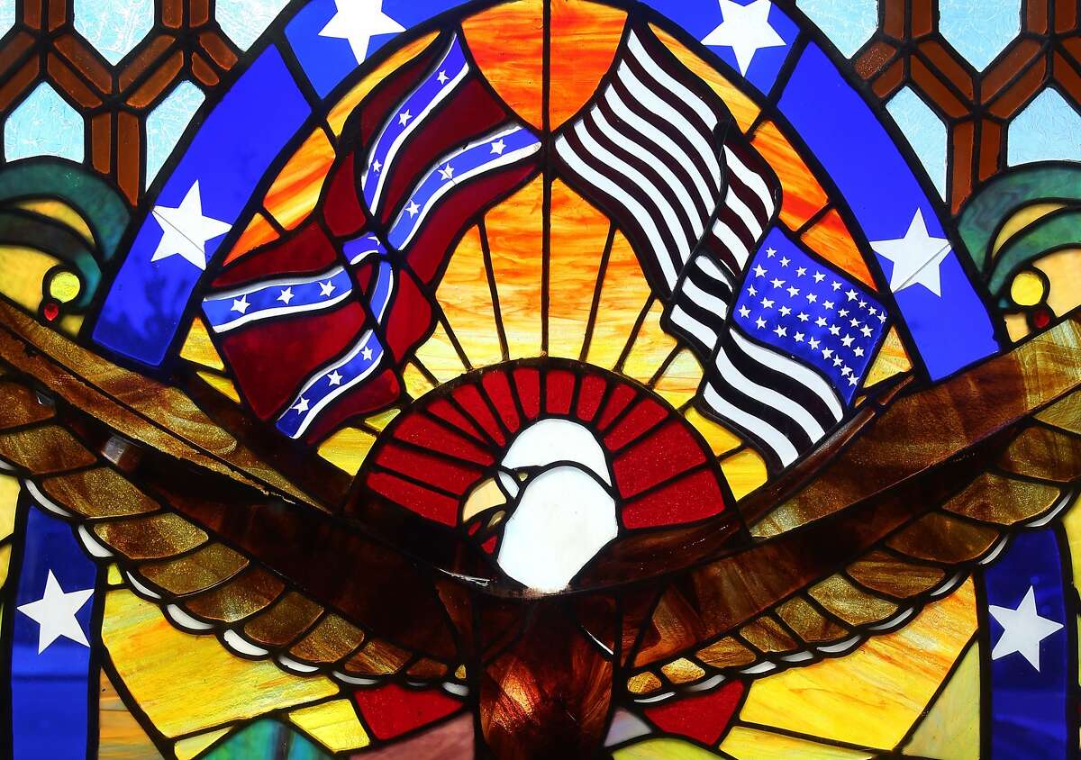 A stained glass panel in the restaurant at the historic Union Hotel bears a Confederate flag flying above a bald eagle in Benicia, Calif. on Wednesday, June 24, 2015. The flag has sparked a national debate after last week's church shooting in South Carolina.