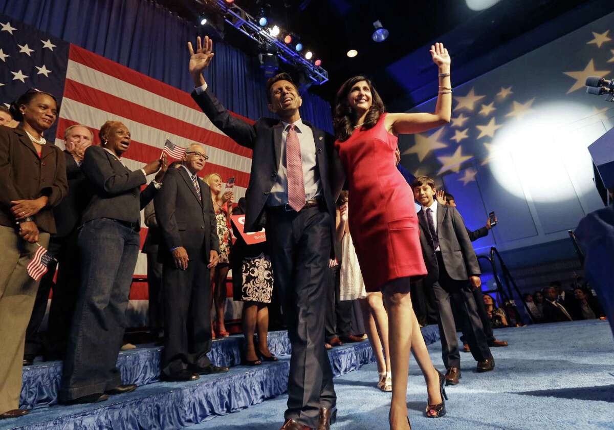 Louisiana Gov. Bobby Jindal waves to the crowd with his wife, Supriya, after he announced his candidacy for president.