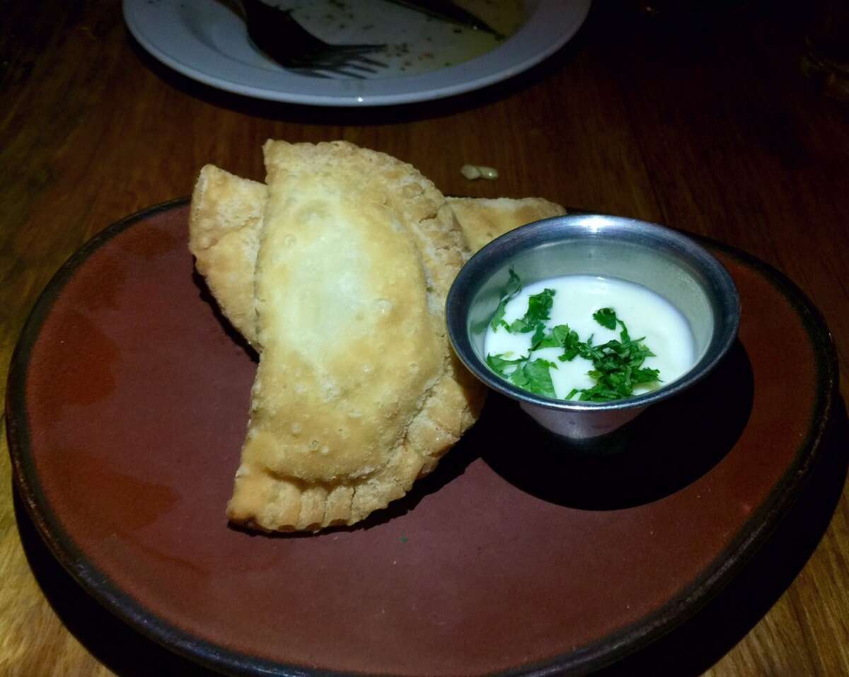 Chicken-filled empanadas have an almost flaky crust ($7).