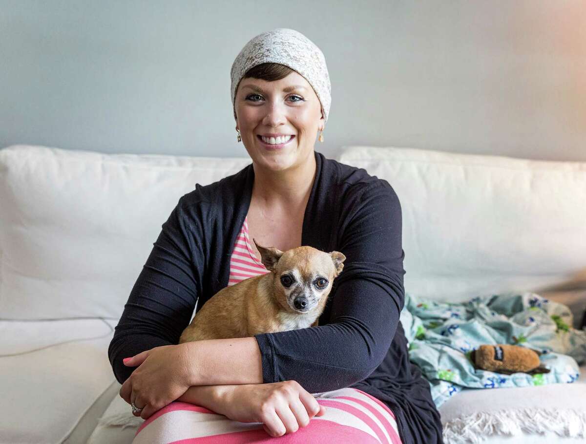 Emily Black discovered she had stage four melanoma when she was 20. When she received the diagnosis, she got "Chiclet" her chihuahua who has been her constant companion. Emily black is now 30 and after much treeatment, urges everyone to be wary of the signs of melanoma. Friday June 19, 2015 (Craig H. Hartley/For the Chronicle)