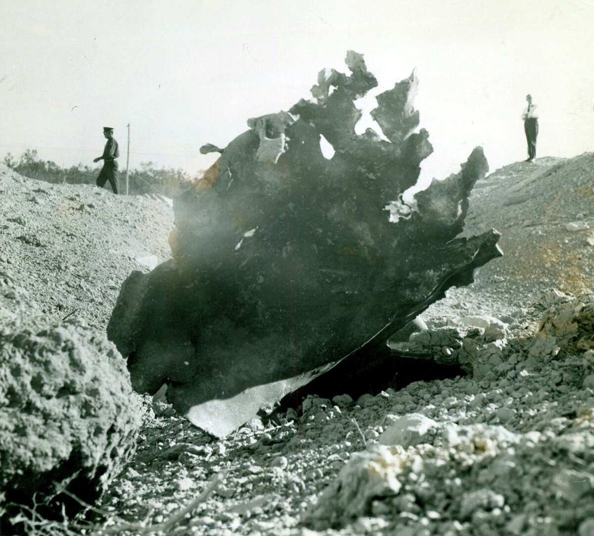A piece of steel is left after a explosion at Medina Air Force Base that left a crater 25 feet deep and 60 yards wide on Nov. 13, 1963.