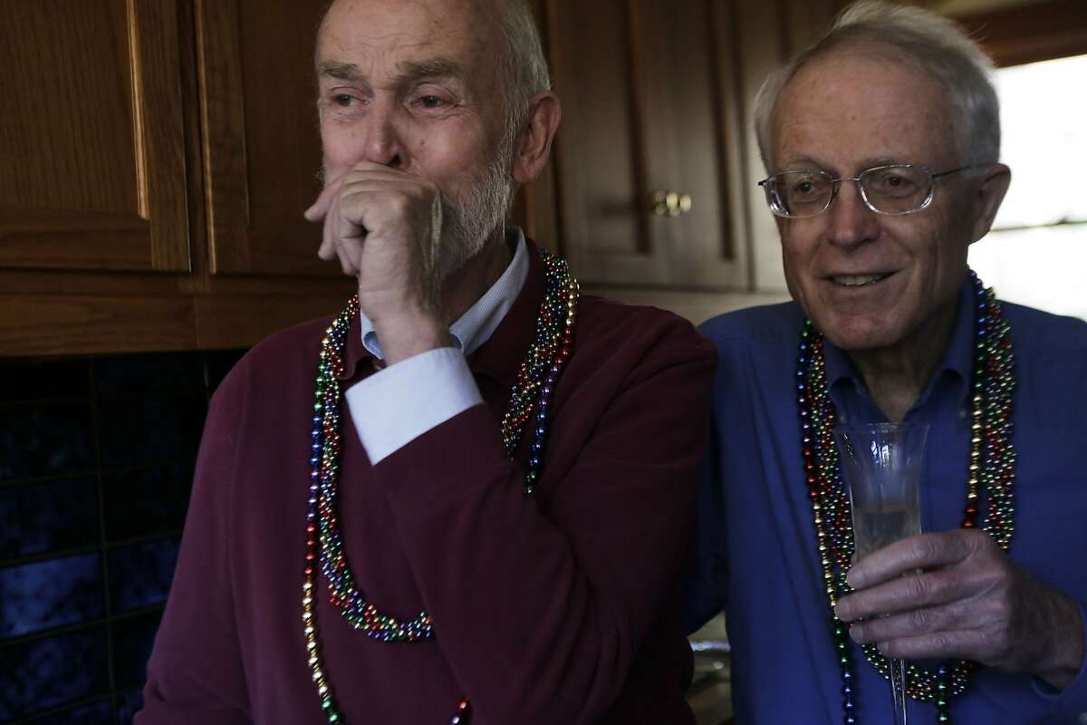 Donald Bird, left, and David Young react to hearing the news of the Supreme Court's decision to recognize the 14th Amendment's requirement to license marriages between two people of the same sex in their San Francisco home on Friday, June 26, 2015. "That is the best news I have ever heard on our television," Bird says. The couple has been together for 49 years.