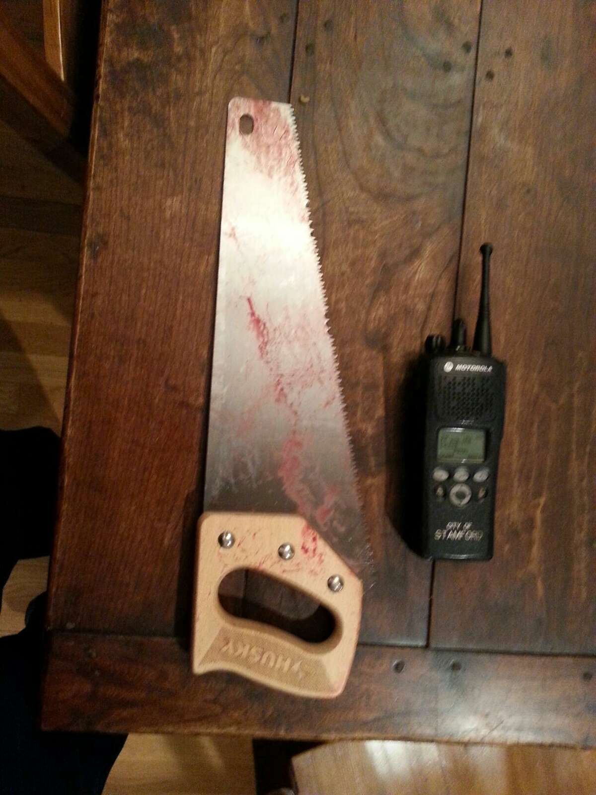 Police say this is the 14-inch handsaw Cesar Olivero allegedly used to nearly hack off the hand of his ex-girlfriend's new boyfriend at her Camp Avenue apartment in Stamford Thursday night.