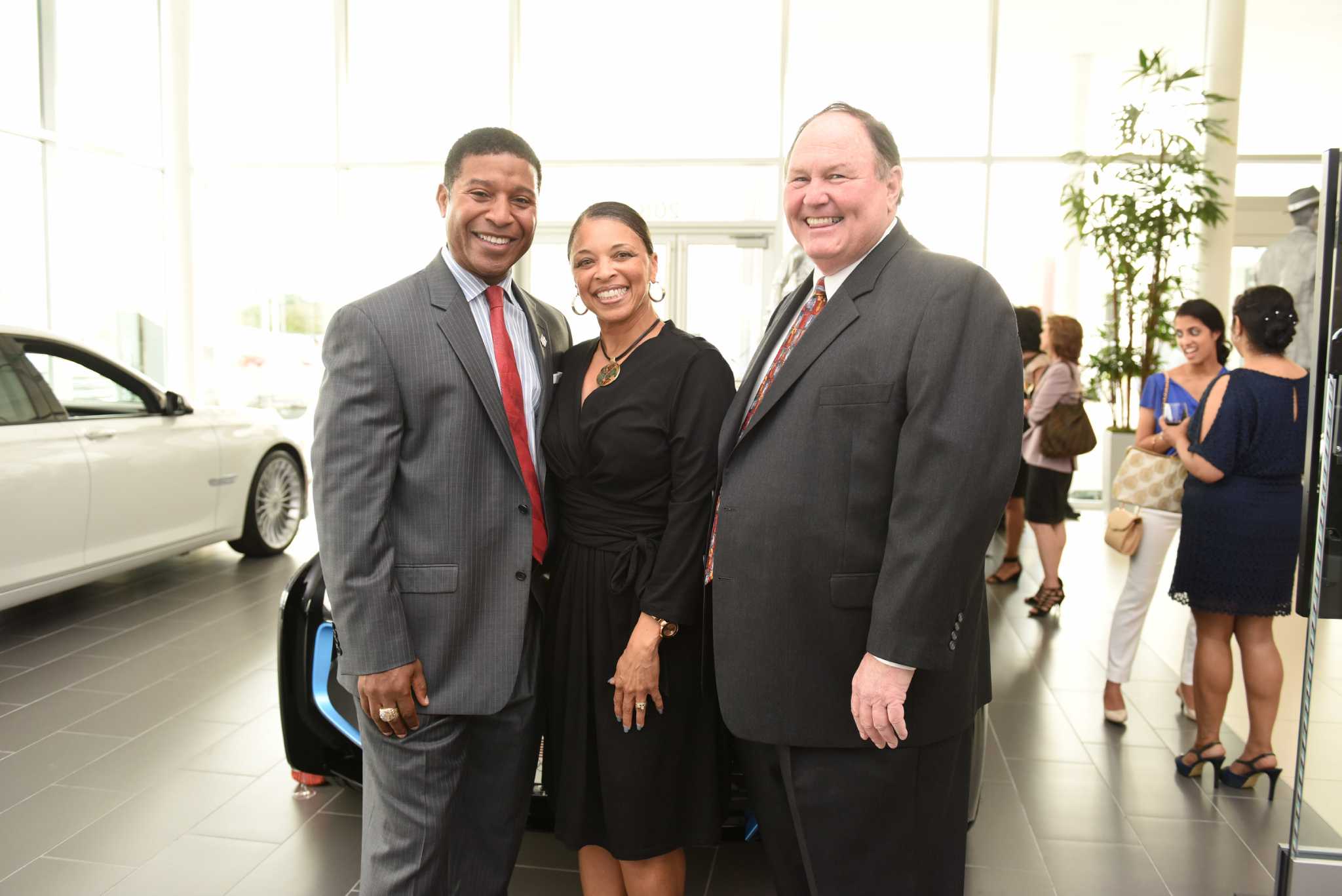 Former Rockets and Texans players celebrate the new BMW West Houston