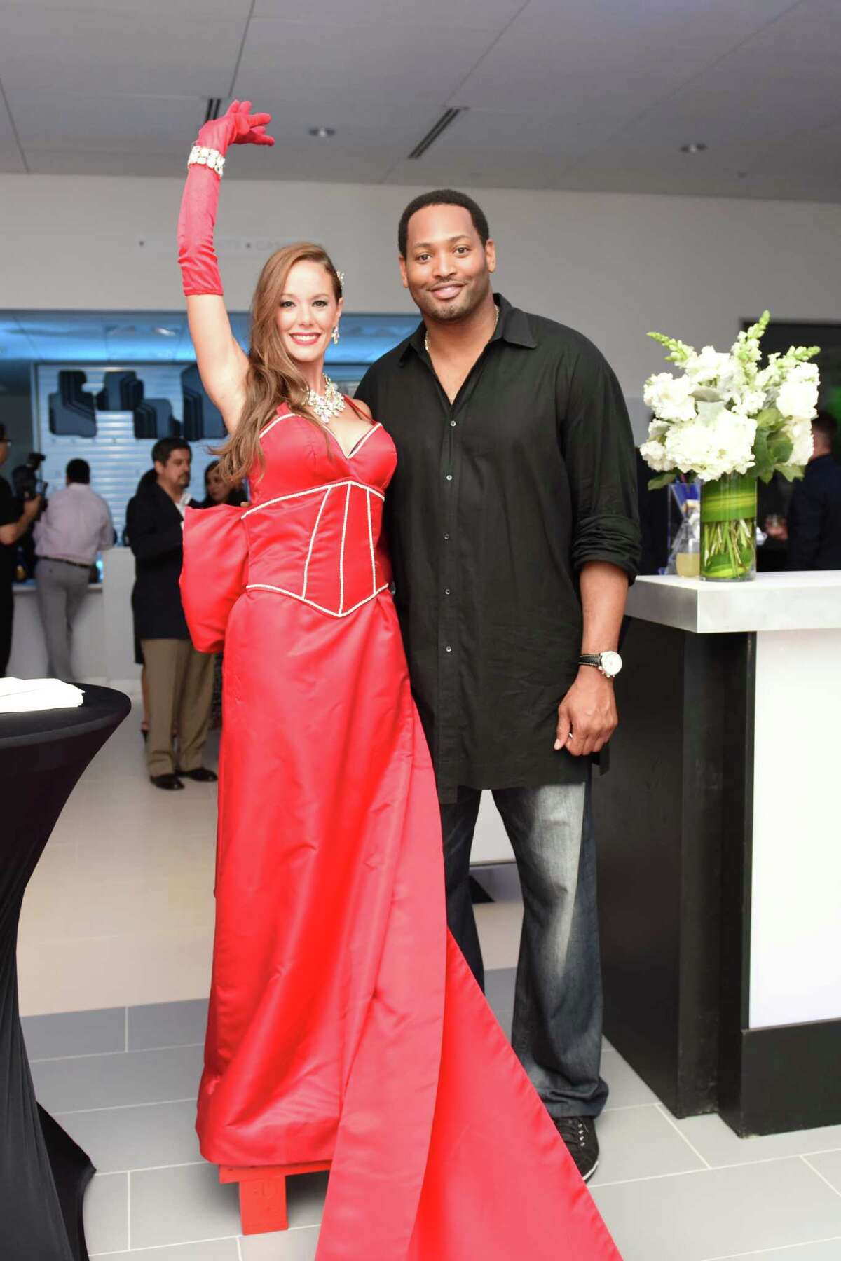 Former Rockets and Texans players celebrate the new BMW West Houston