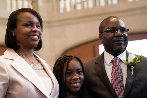 Mayor Ivy Taylor stands with her husband Rodney and daughter Morgan after being introduced at City Hall in San Antonio.