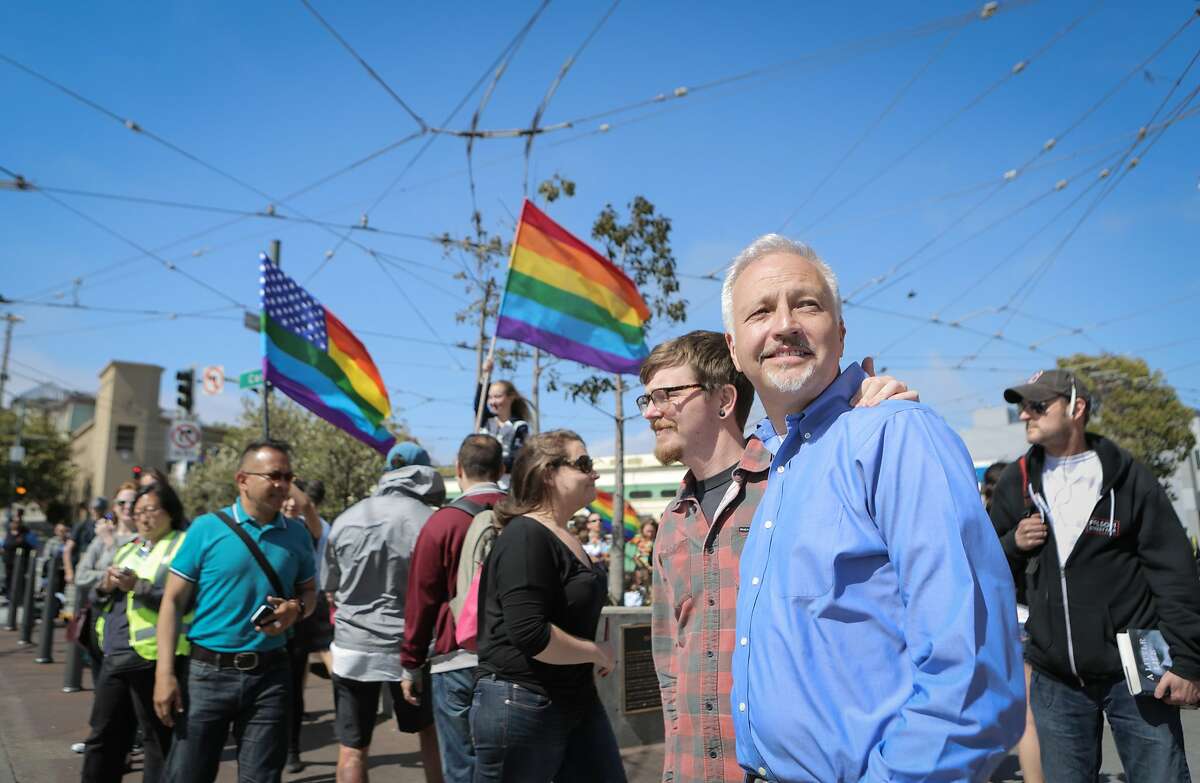 Matt Foreman (in blue), Senior Program Director at the Haas Jr. Fund, walks through San Francisco's Castro neighborhood with boyfriend Rob Brambley on Friday, June 26, 2015. Earlier in the day, the Supreme Court declared same-sex marriage legal In all 50 states. The Haas Jr. Fund has been a key player in the fight for marriage equality.