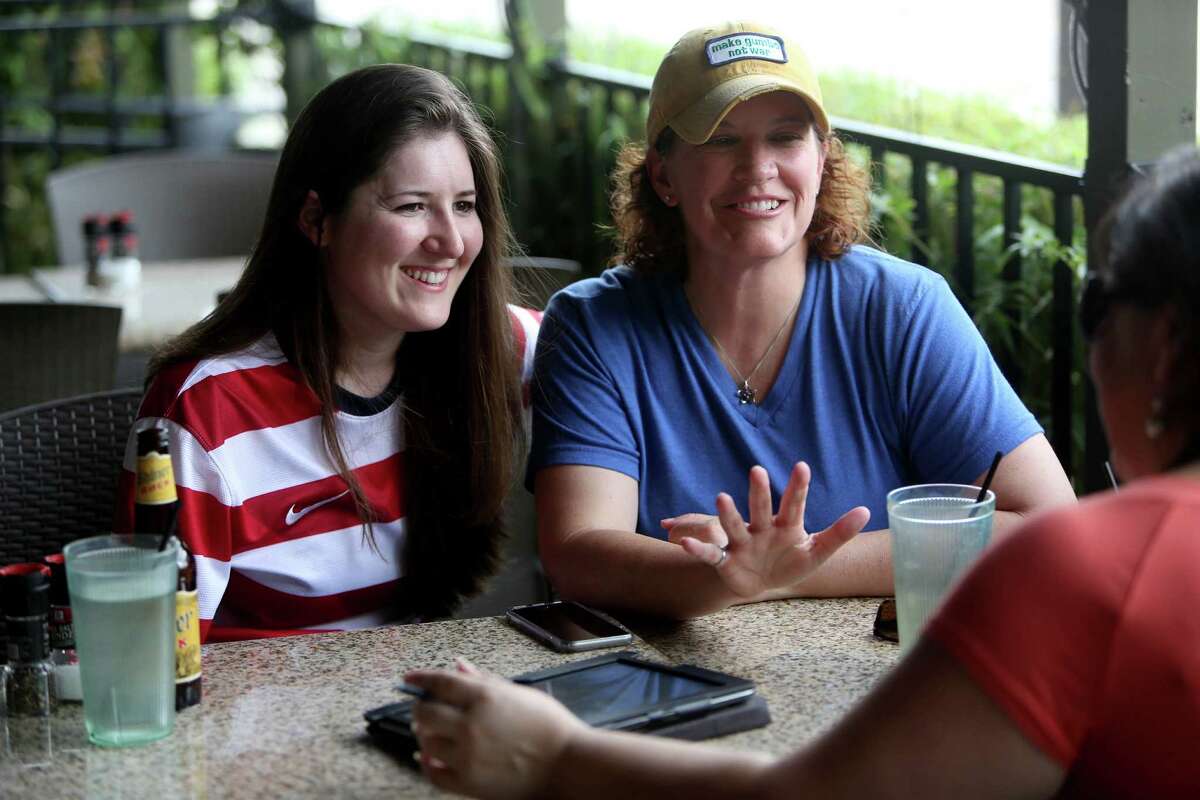 Stephanie Hearn, 25, left, and Theresa Broussard, 45, meet with wedding planner Claudia de Velasco, of A Day to Remember, at Ruggles Green Friday, June 26, 2015, in Houston. Hearn and Broussard, a couple for over three years, plan on being married Oct. 9, 2015 at the Astorian in Houston. The Supreme Court of the United States on Friday ruled that same-sex couples can marry nationwide. ( Gary Coronado / Houston Chronicle )