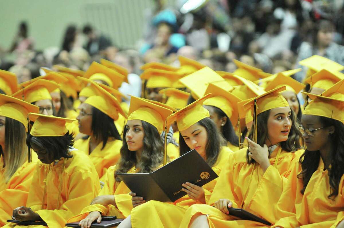 Graduates watch as their fellow graduates receive their diplomas at the Troy High School graduation at Hudson Valley Community College, on Sunday, June 28, 2015, in Troy, N.Y. (Paul Buckowski / Times Union)