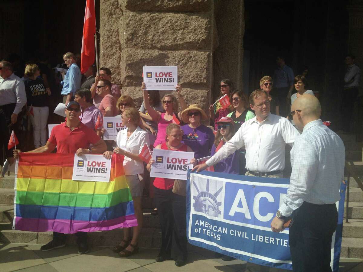 Texans gather on the steps of the state Capitol on Monday, June 29, 2015 to celebrate the U.S. Supreme Court's recent ruling legalizing same-sex marriage.