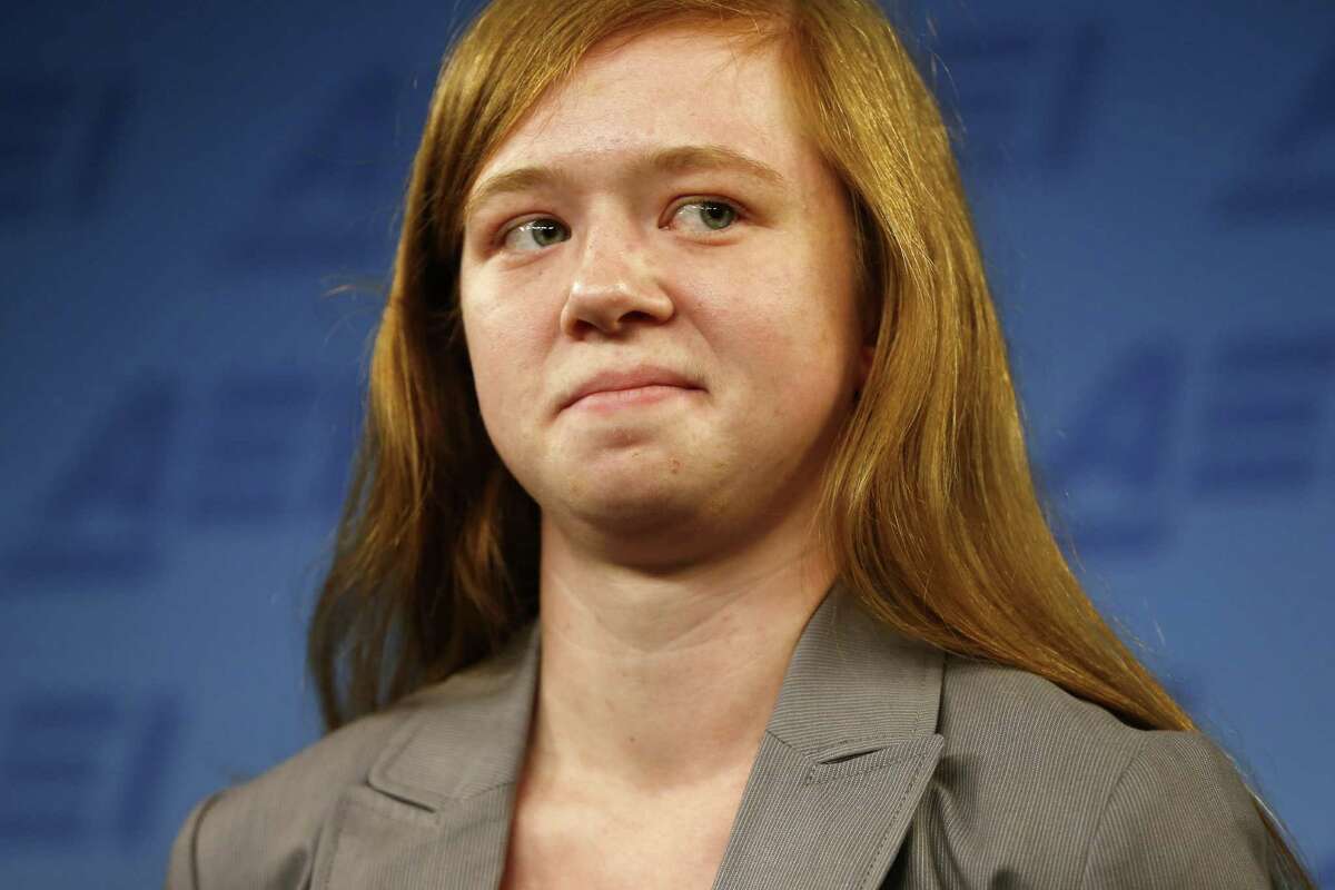 Abigail Fisher, who sued the University of Texas when she was not offered a spot at the university's flagship Austin campus in 2008, stands at a news conference at the American Enterprise Institute in Washington, Monday, June 24, 2013. The U.S. Supreme Court ruling on affirmative action in higher education will have "no impact" on the University of Texas' admissions policy, school president Bill Powers said Monday, noting UT will continue to use race as a factor in some cases. (AP Photo/Charles Dharapak)