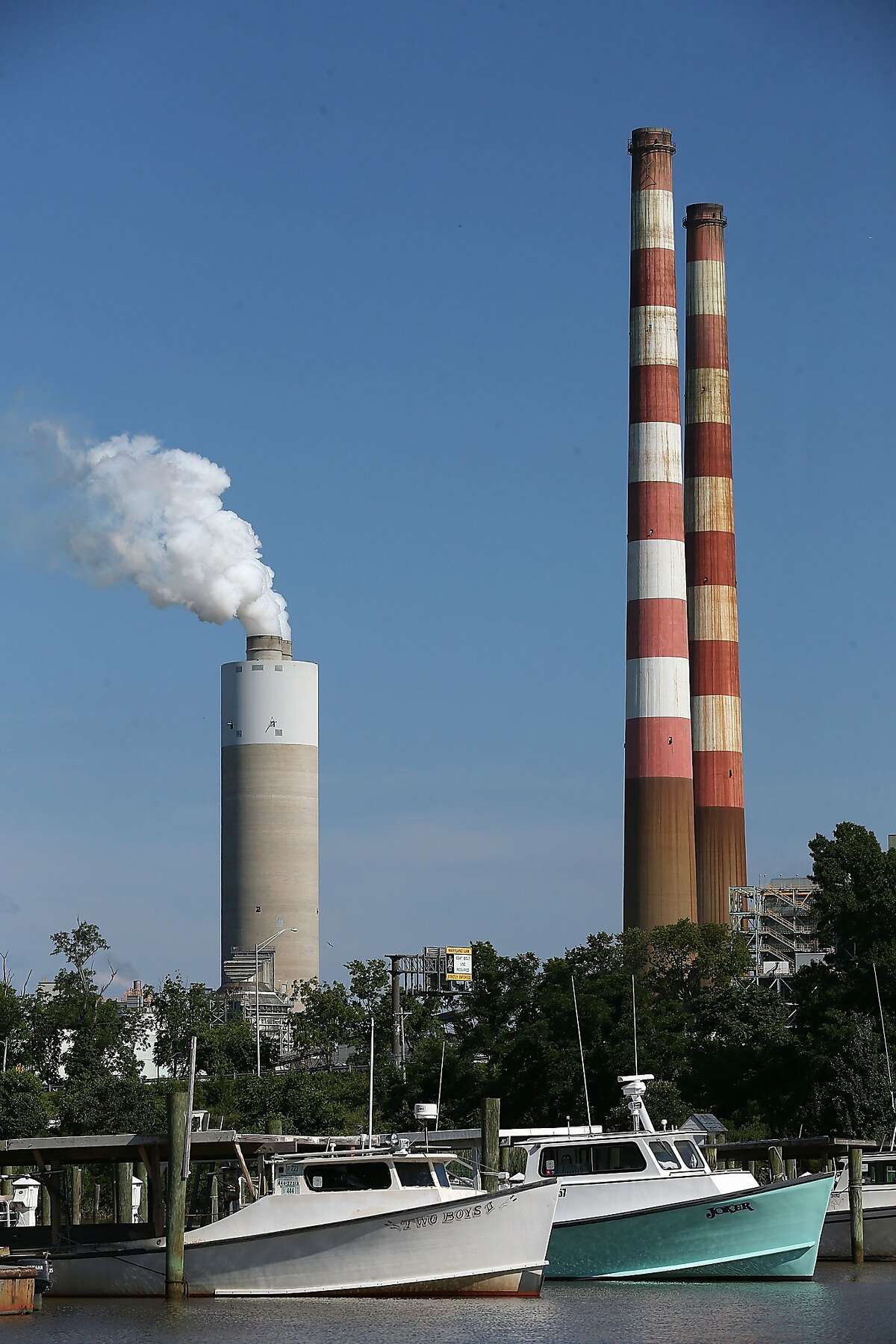 NEWBURG, MD - JUNE 29: Boats are docked at the Aqualand Marina as emissions spew out of a large stack nearby at the coal-fired Morgantown Generating Station June 29, 2015 in Newburg, Maryland. Today the U.S. Supreme Court ruled against the Environmental Protection Agency's (EPA) effort to limit certain power plant emissions -- saying the agency "unreasonably" failed to consider the cost of the regulations. (Photo by Mark Wilson/Getty Images)