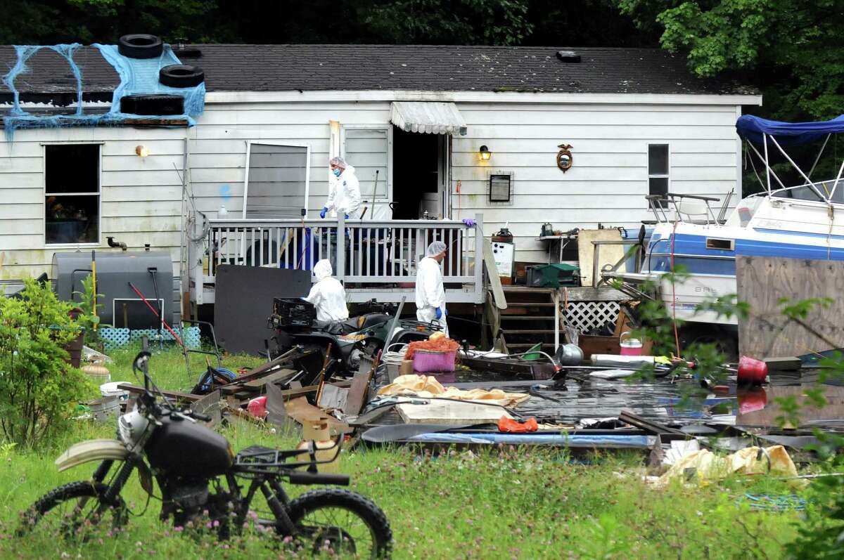 State Police forensic investigators scour for evidence at 96 Fox Hill Rd. on Tuesday, June 30, 2015, in Edinburg, N.Y. Resident Richard Laport, 51, died after an encounter with officers. (Cindy Schultz / Times Union)