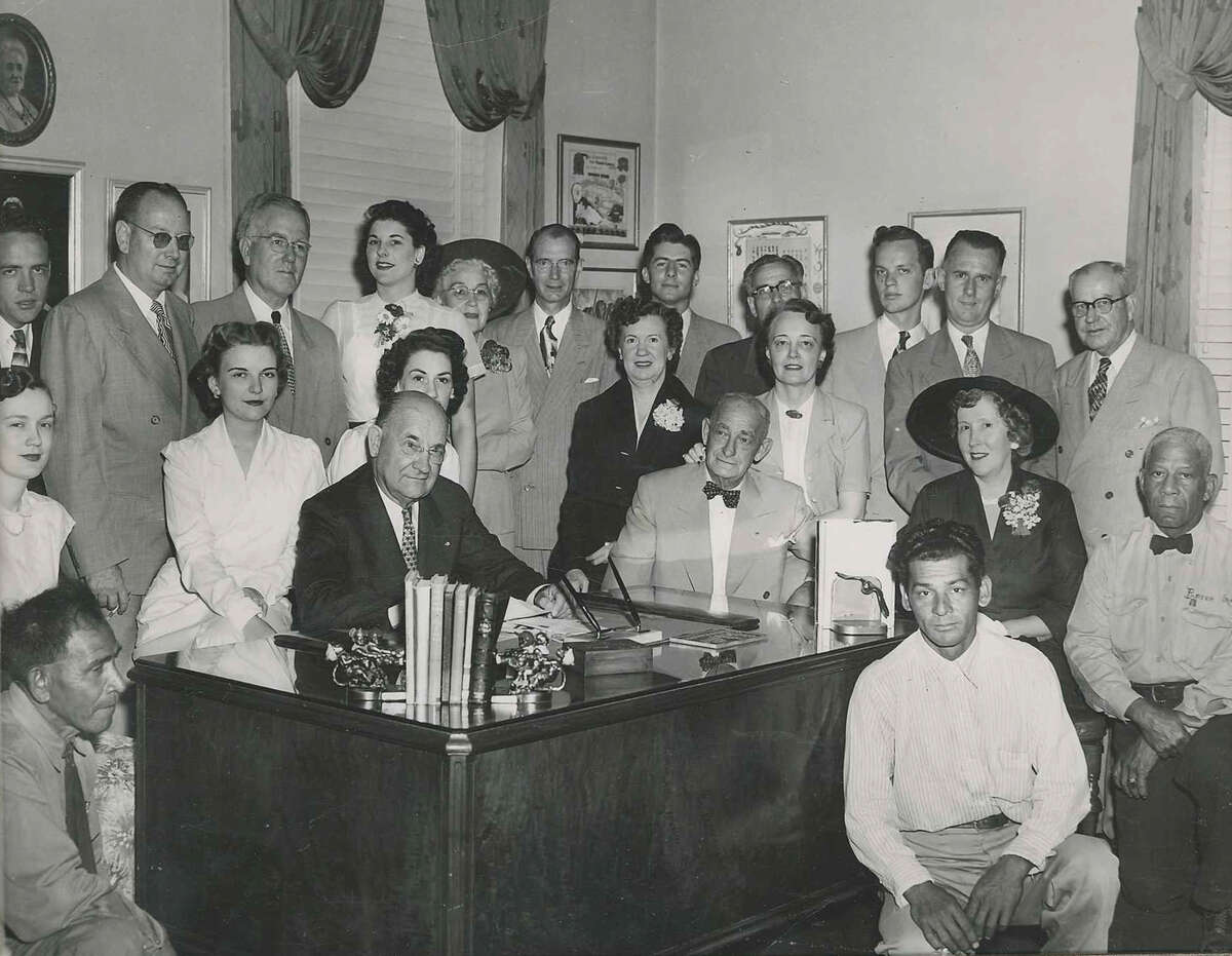 A group photo of Porter Loring Funeral Home and its employees.The company was founded in 1918 by Porter Loring and is now managed by a fourth generation family member.