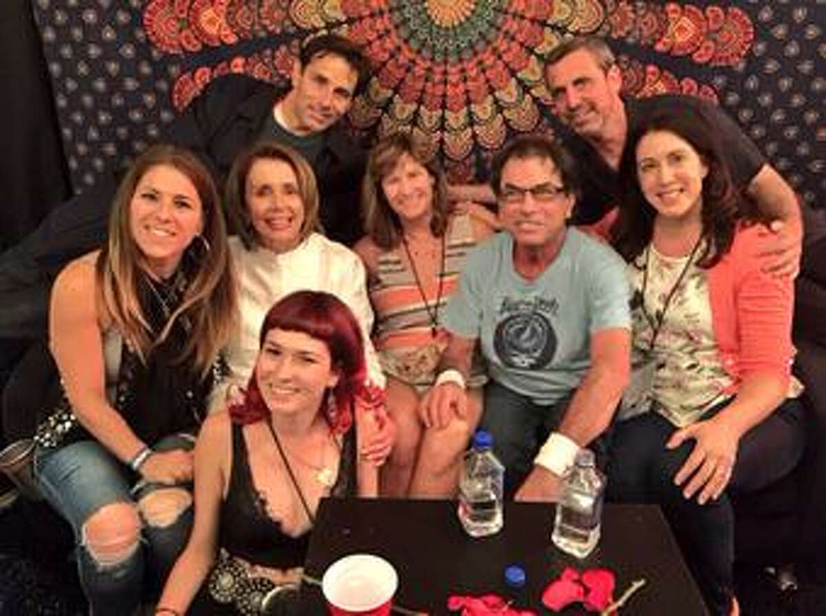Nancy Pelosi backstage with her family and Mickey Hart