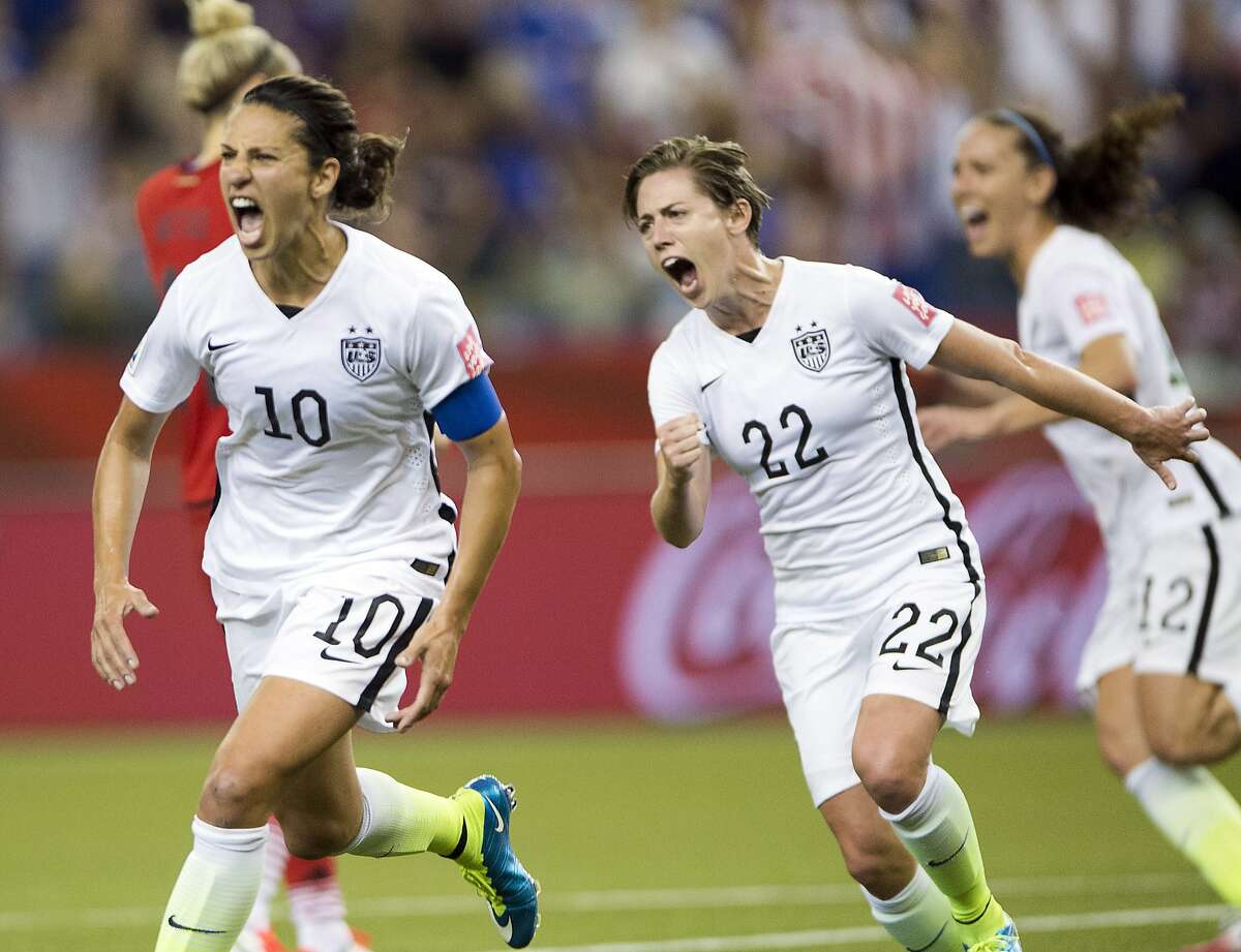 United States' Carli Lloyd (10) reacts after scoring on a penalty kick against Germany as Meghan Klingenberg (22) follows during the second half of a semifinal in the Women's World Cup soccer tournament, Tuesday, June 30, 2015, in Montreal, Canada. (Ryan Remiorz/The Canadian Press via AP)