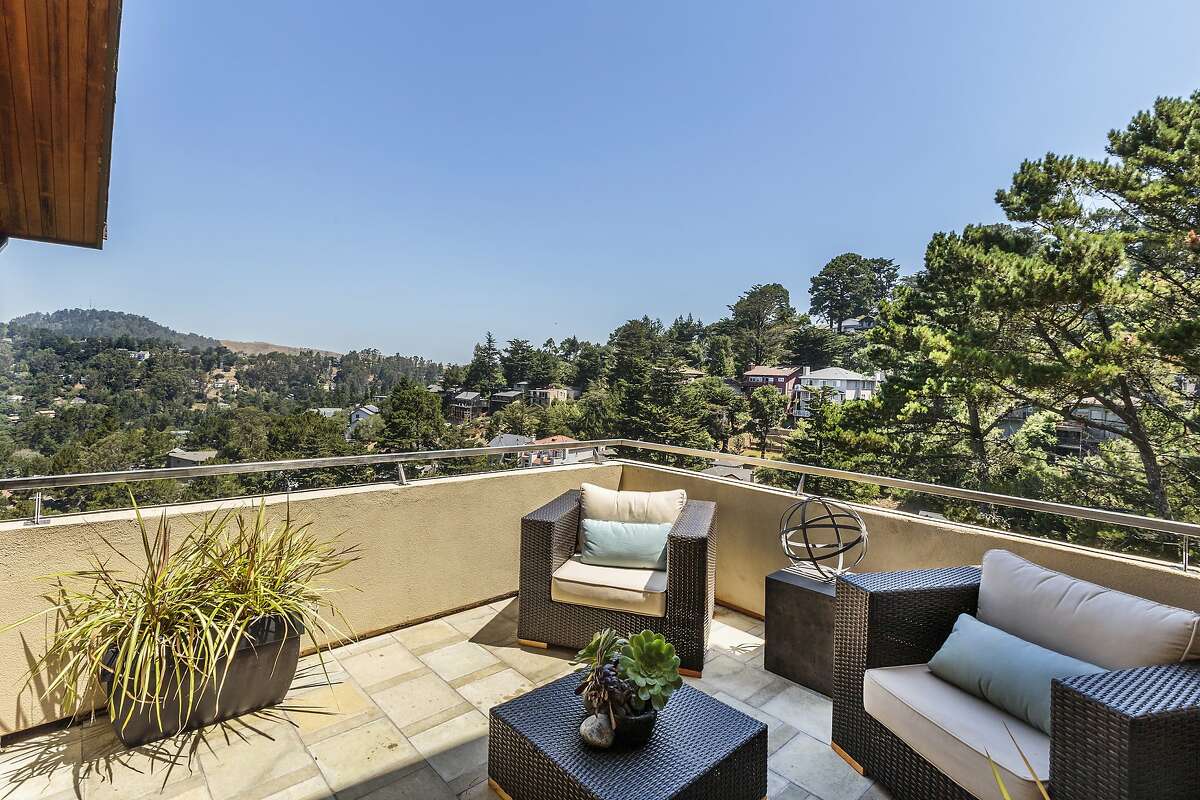 New patios, interior color scheme define Oakland view home