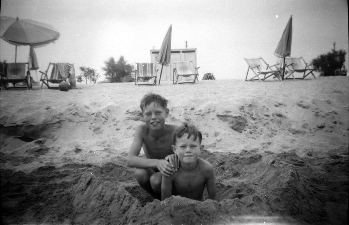 Mick Jagger, left, age 8, on a family holiday with his younger brother Chris in 1951. This previously unseen image will form part of The Rolling Stones - 'Exhibitionism' at London's Saatchi Gallery. 