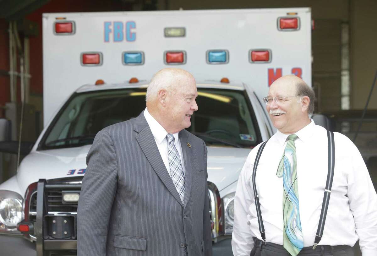 Fort Bend County Judge, Robert "Bob" Hebert, left, and Meadows Place Mayor, Charles Jessup, right, talk at the Stafford Fire Station No. 3, 11803 Kirkwood Road, Tuesday, June 30, 2015, in Meadows Place. Fort Bend County EMS relocated the Medic 3 ambulance to the fire station in the city of Meadows Place for better response in the growing area.