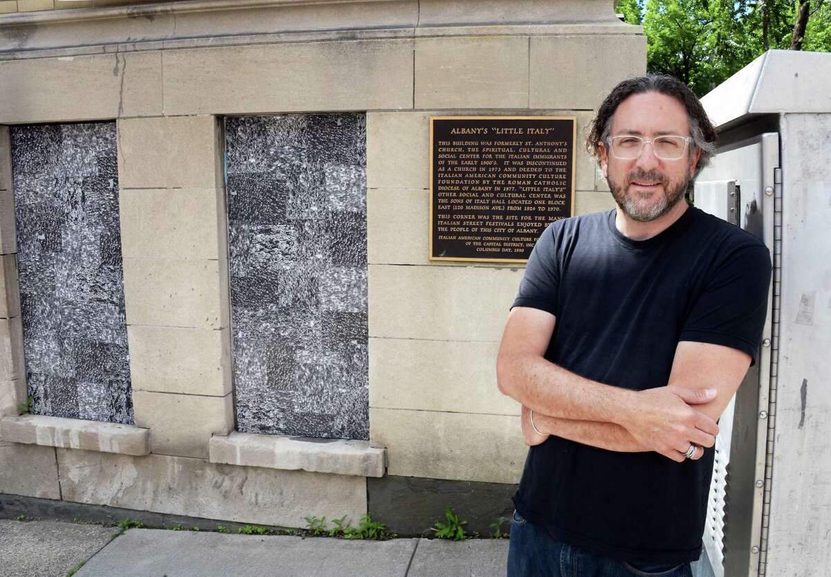 Artist Thomas Lail beside two of his 11 cut xerographic panels "Crowd", at the former St. Anthony's Church along Madison Ave. Wednesday June 24, 2015 in Albany, NY. (John Carl D'Annibale / Times Union)