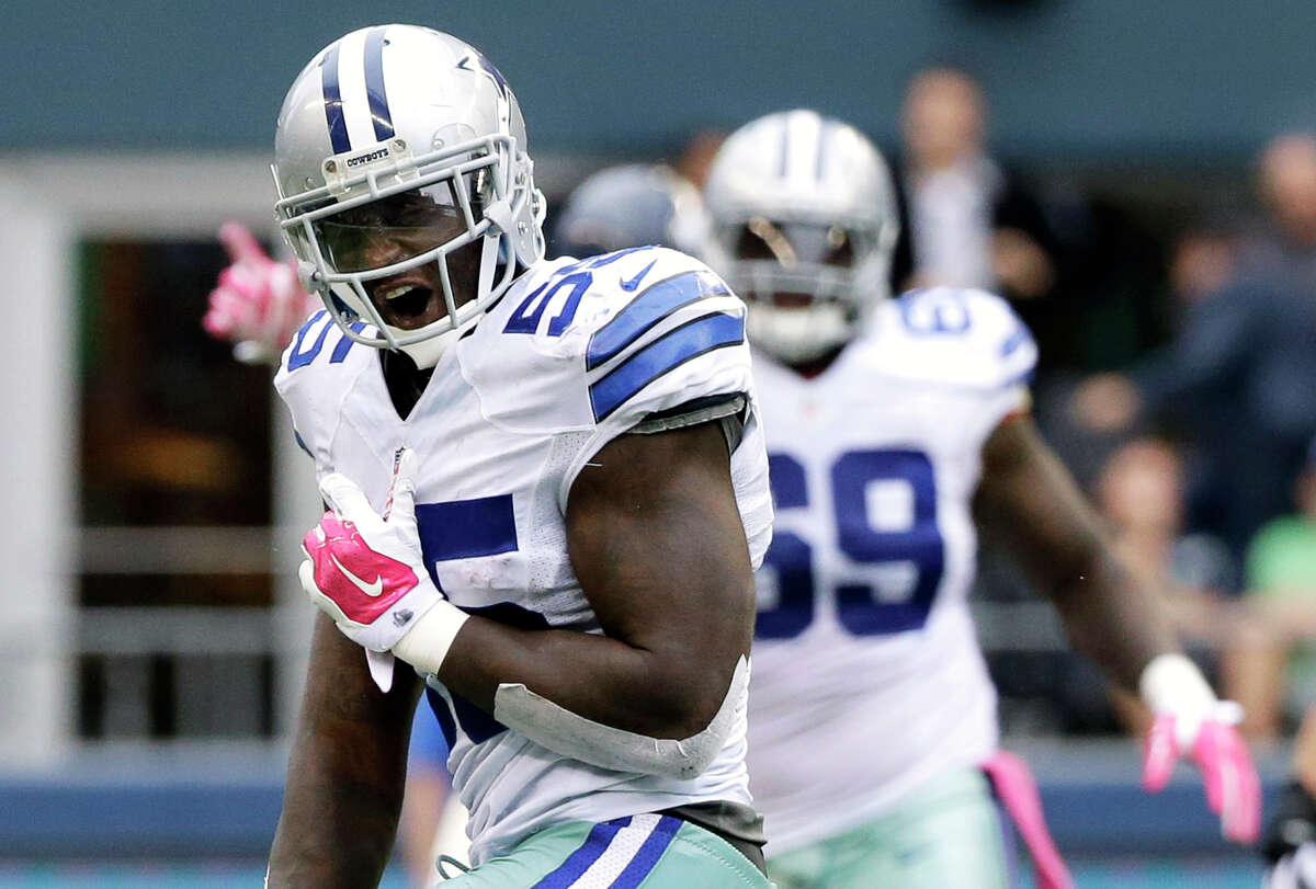 Dallas Cowboys middle linebacker Rolando McClain celebrates after he intercepted a pass late in the second half of an NFL football game against the Seattle Seahawks in Seattle on Oct. 12, 2014.