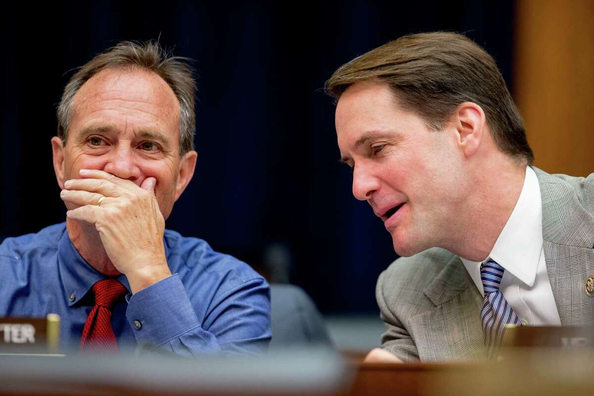 Rep. Ed Perlmutter, D-Colo., left, and Rep. Jim Himes, D-Conn., right, speak together as Treasury Secretary Jacob Lew testifies on Capitol Hill June 17, before a House Financial Services committee hearing on the annual report of the Financial Stability Oversight Council. (AP Photo/Andrew Harnik)