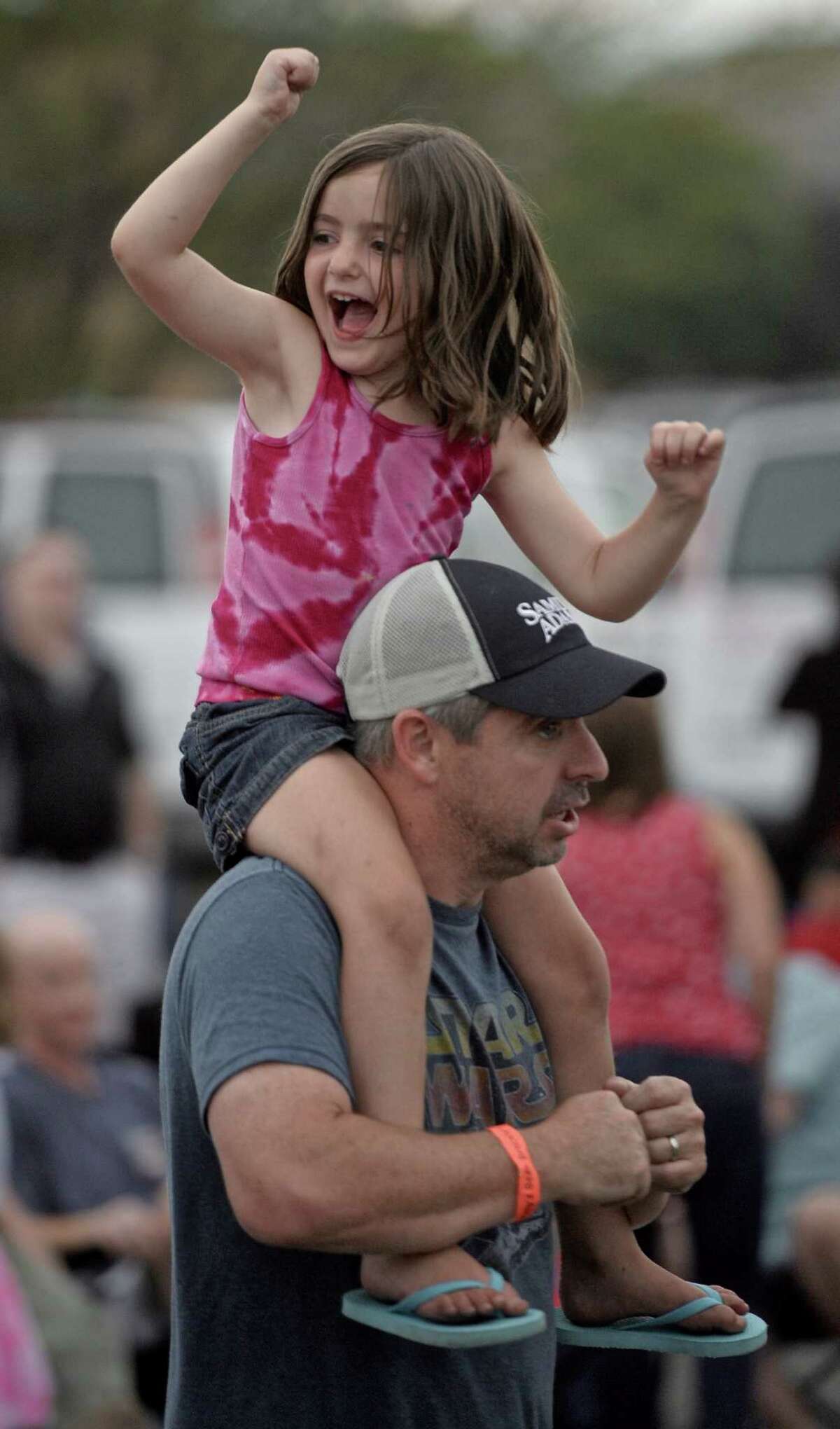 Molly Carey, 5, of Danbury, dances up a storm with her dad, Make Carey, to the song "Sweet Caroline" before the fireworks at the Danbury Fair Mall, on Thursday night, July 2 2015, in Danbury, Conn.