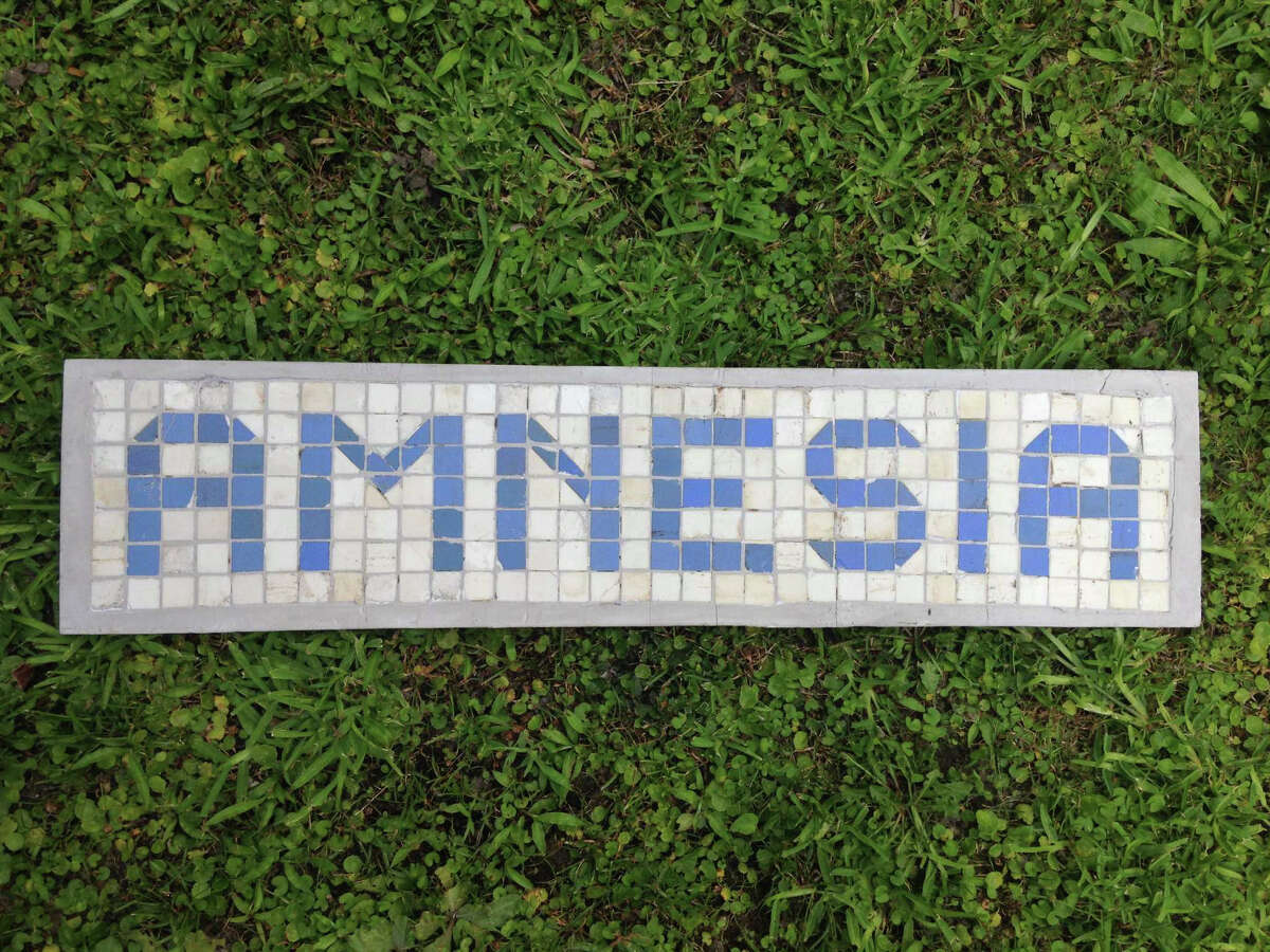 Amnesia, by James Glassman, aka the Houstorian. The piece uses blue and white tiles from Houston's old curbs.