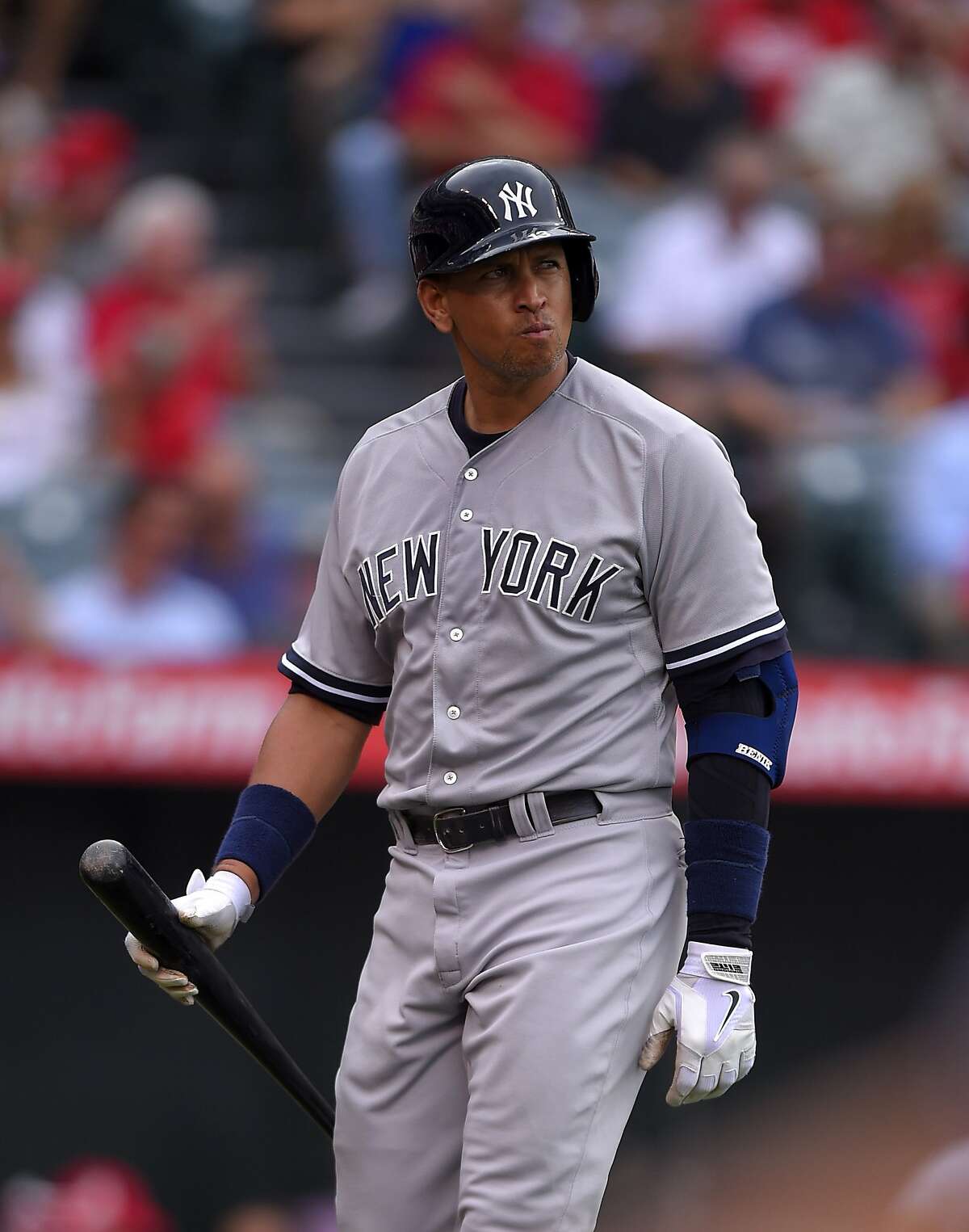 New York Yankees' Alex Rodriguez walks back to the dugout ofter striking out during a baseball game against the Los Angeles Angels, Wednesday, July 1, 2015, in Anaheim, Calif. (AP Photo/Mark J. Terrill)