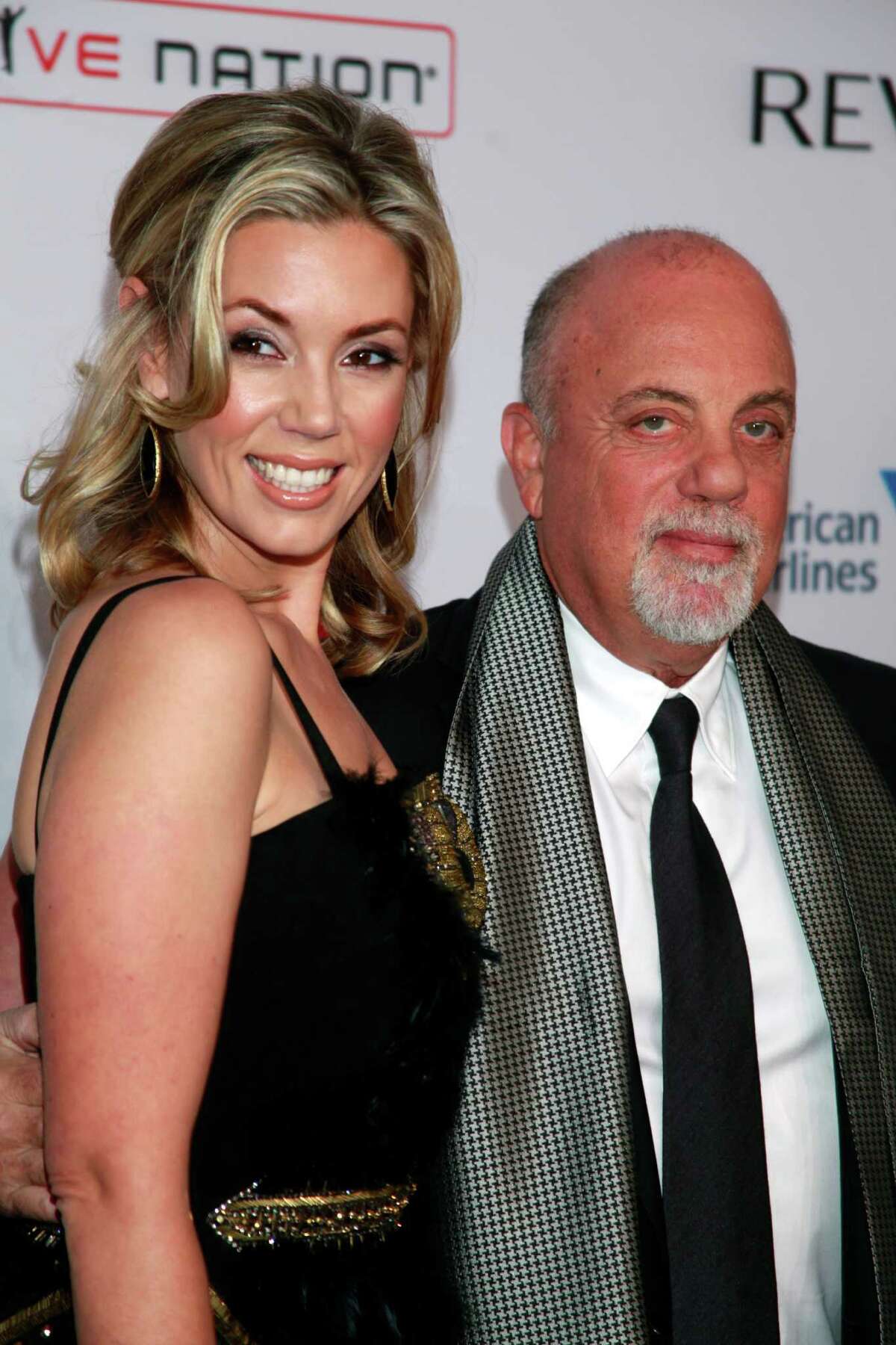 FILE - In this Oct. 15, 2013 file photo, Alexis Roderick, left, and Billy Joel arrive at the Elton John AIDS Foundation's 12th Annual "An Enduring Vision" benefit gala in New York. Joel married girlfriend Alexis Roderick in a surprise ceremony at the couple?’s annual July 4 party. The singer?’s spokeswoman Claire Mercuri says New York Gov. Andre Cuomo presided over Saturday?’s nuptials at Joel?’s Long Island estate. (Photo by Carlo Allegri/Invision/AP, File) ORG XMIT: NYET601