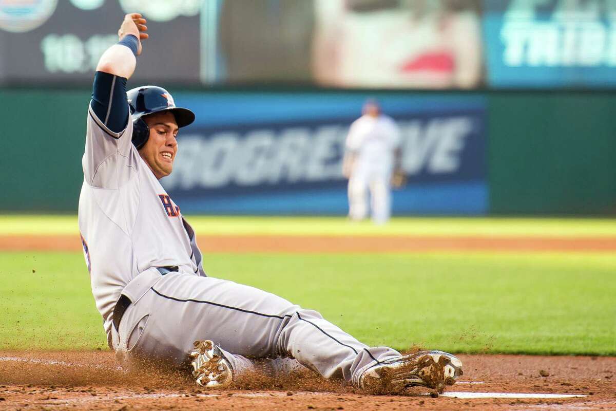 Preston Tucker scores on a hit by Evan Gattis as part of a four-run first inning that saw the Astros get the carousel at Progressive Field going early. Tucker was 4-for-5 with two runs and two RBIs on his 25th birthday.