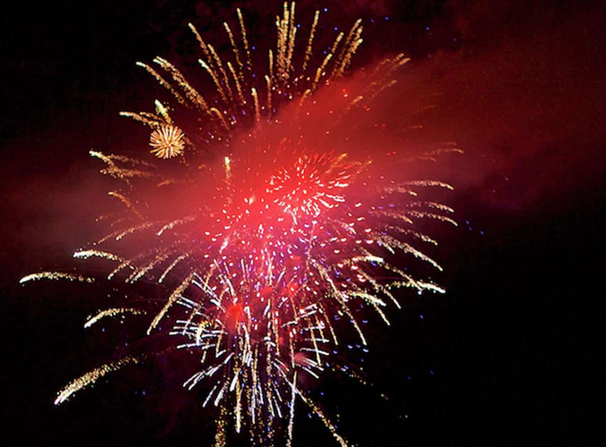 Fireworks sponsored by the Greater New Milford Chamber of Commerce light up the night during New Milford's Fourth of July celebration, July 3, 2015